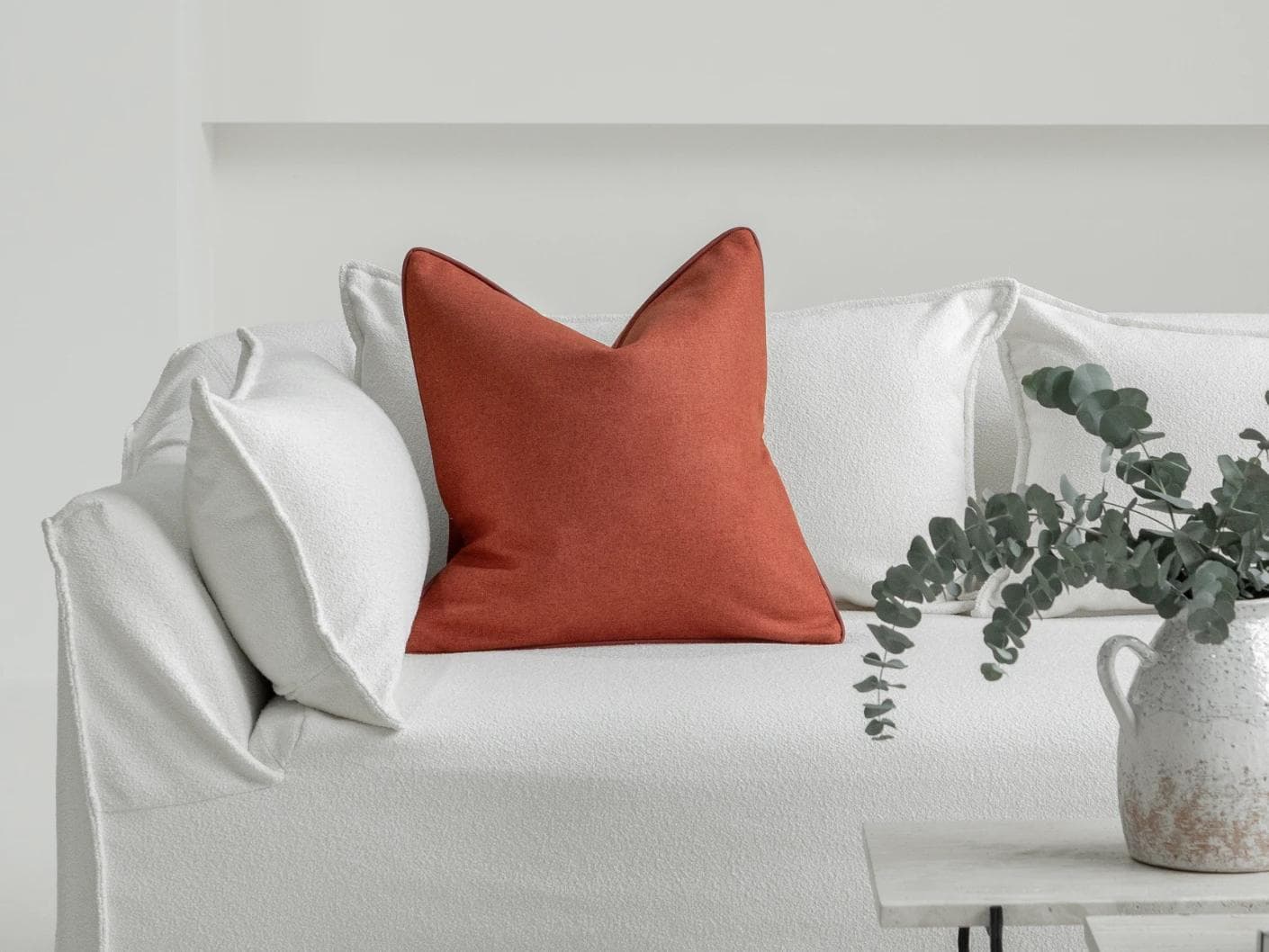 Silvie Scarlet cushion in orange, shown in a lifestyle front view as image 4