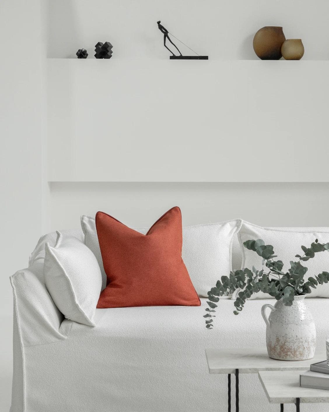 Silvie Scarlet cushion in orange, shown in a lifestyle front view as image 4