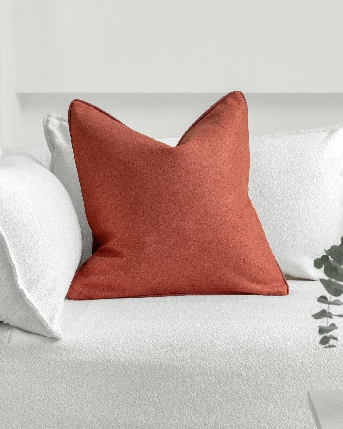 Silvie Scarlet cushion in orange, shown in a lifestyle front view as image 2