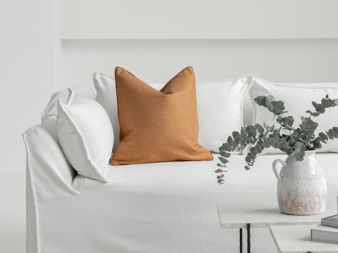 Silvie Tangelo cushion in rust, shown in a lifestyle front view as image 4