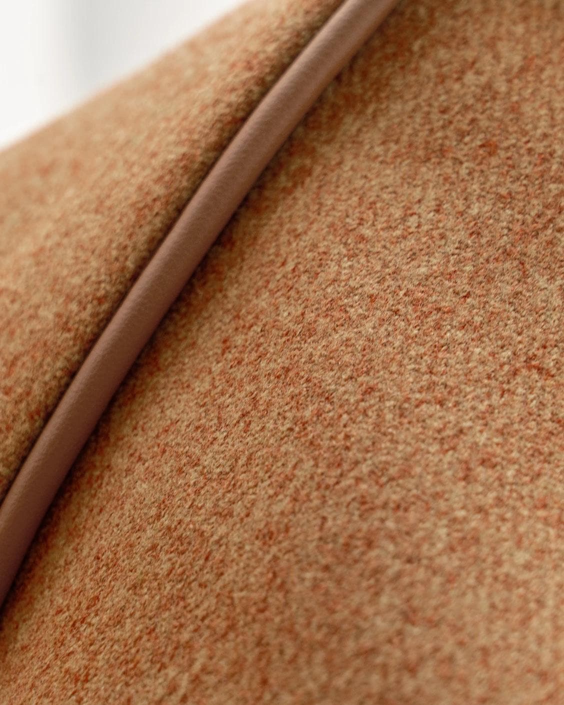 Silvie Tangelo cushion in rust, shown in a product close-up as image 7