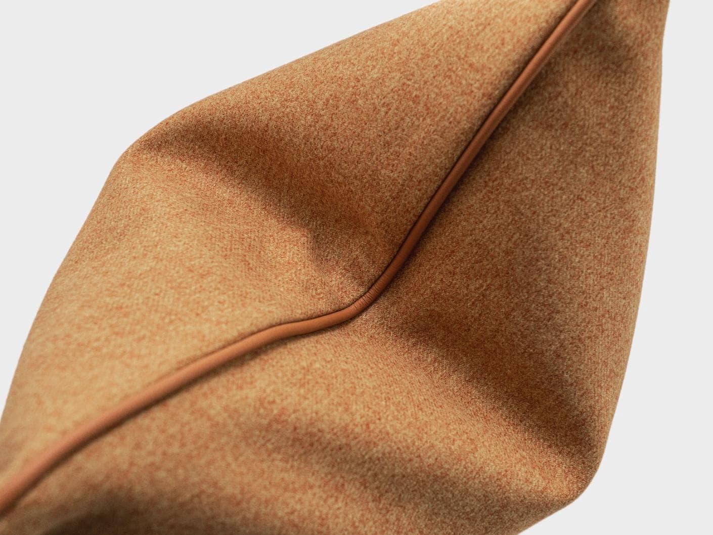 Silvie Tangelo cushion in rust, shown in a product top view as image 9