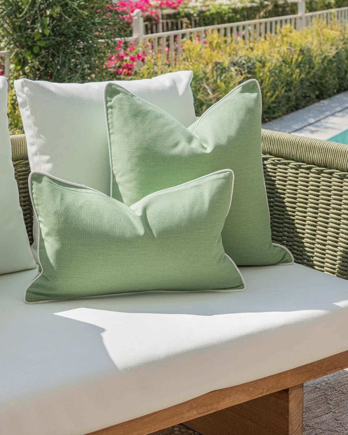 Sina Bundle cushion in green and ivory, shown in a lifestyle left view as image 5
