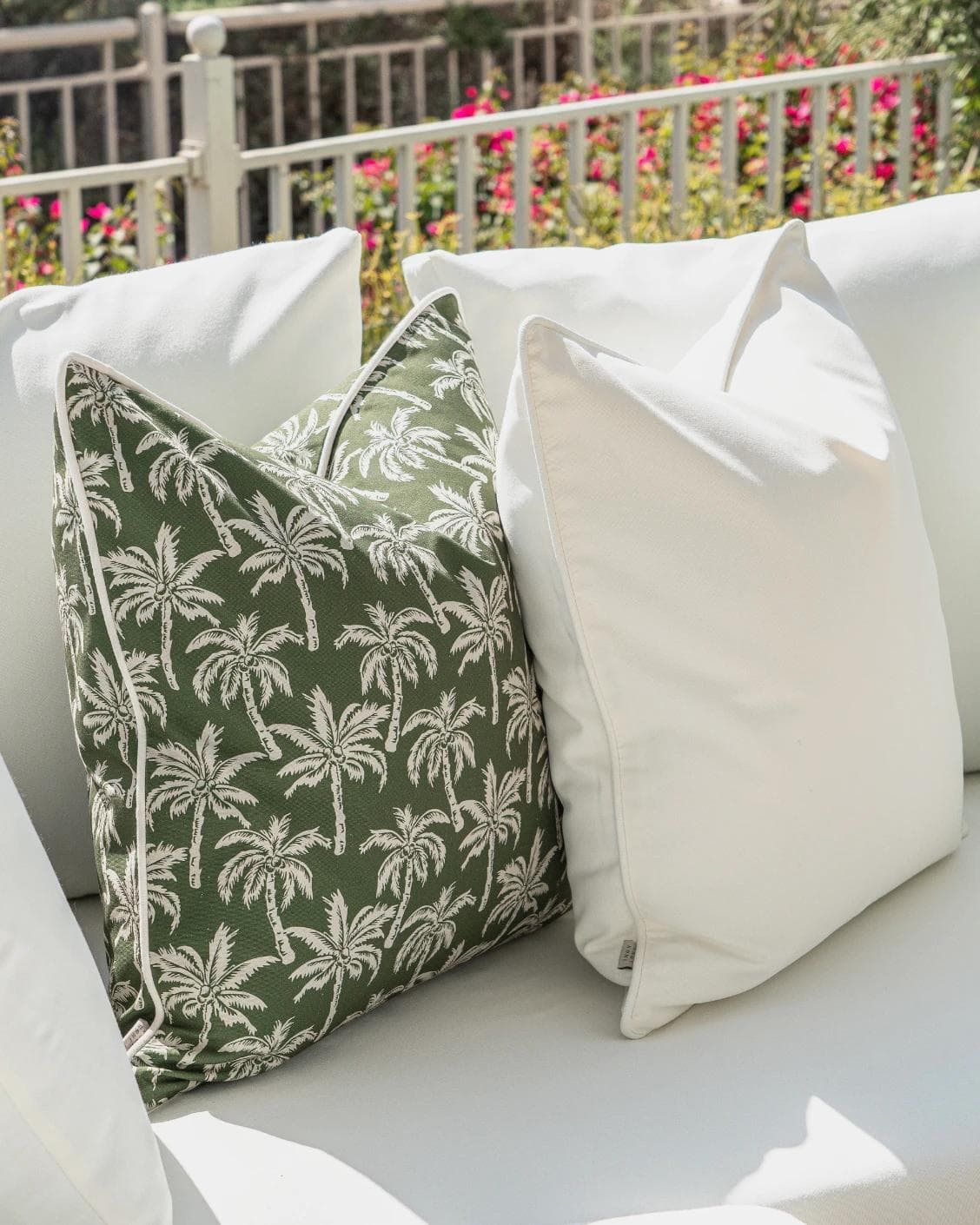 Sina Bundle cushion in green and ivory, shown in a lifestyle left view as image 7