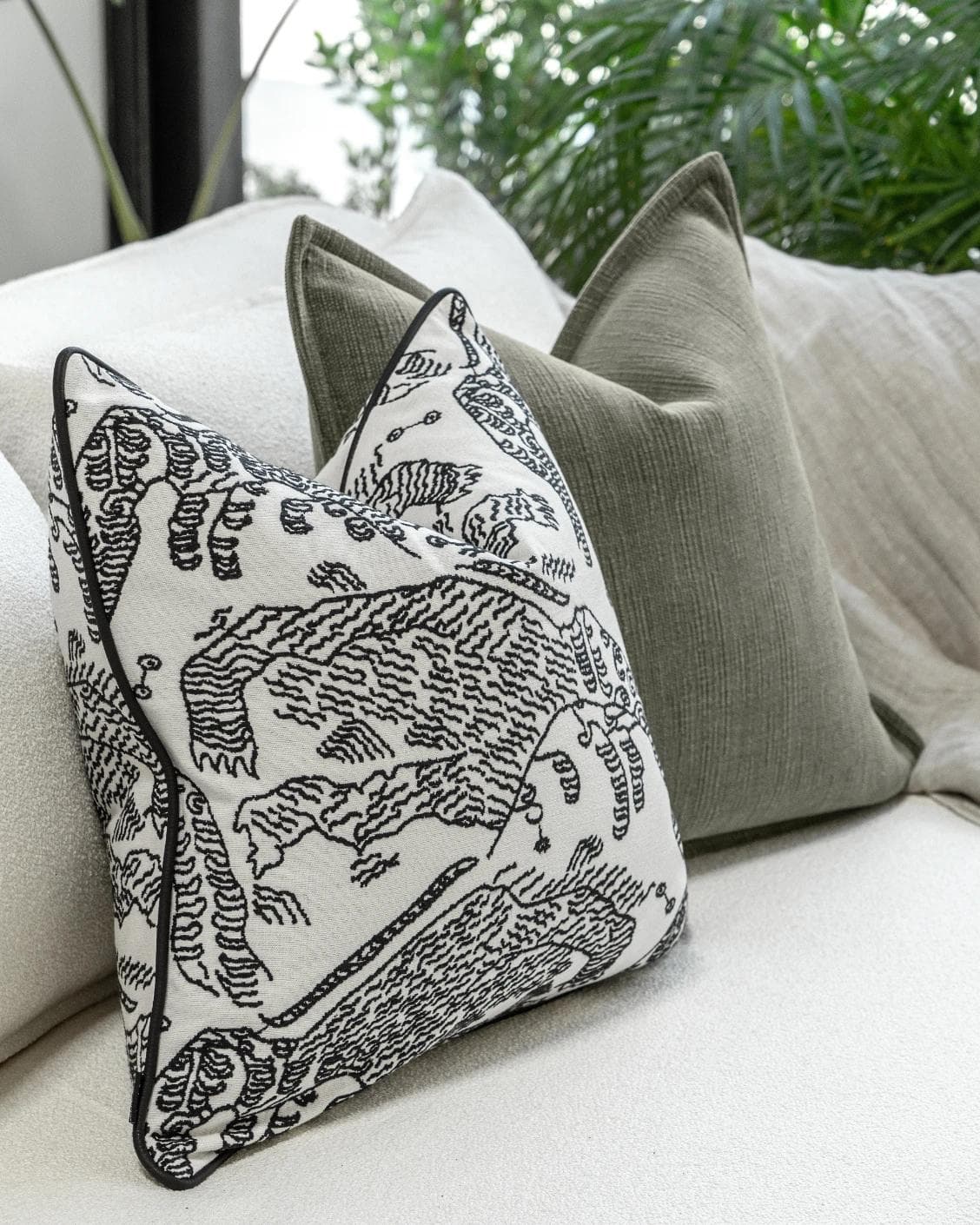 Sovi Bundle cushion in black and white, shown in a product left view as image 5