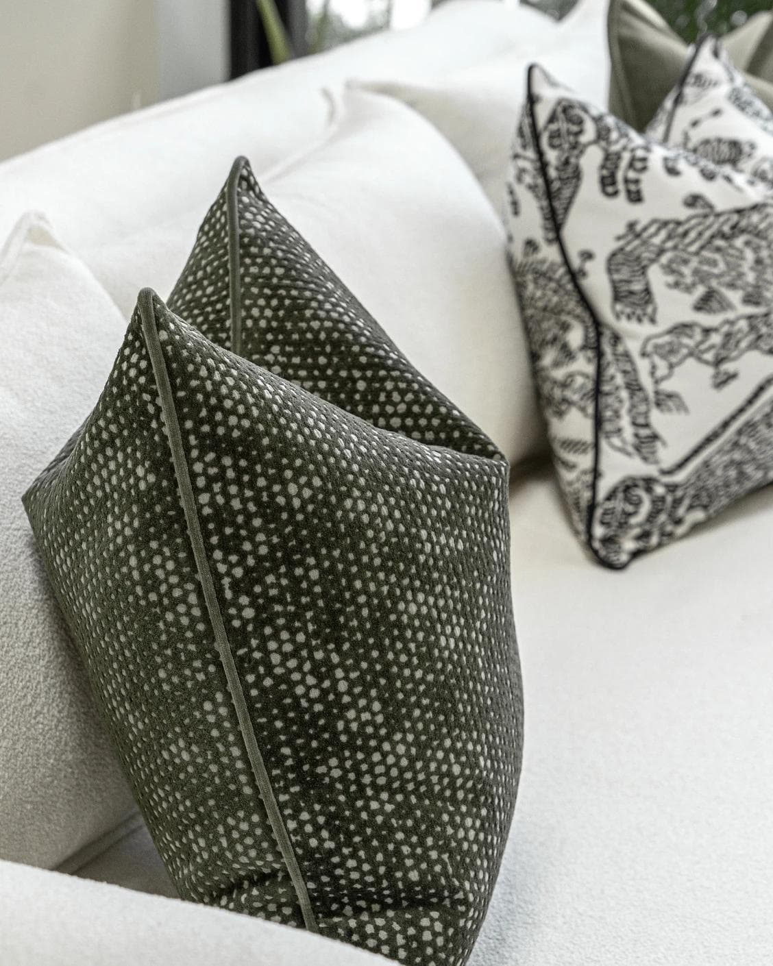 Sovi Bundle cushion in black and white, shown in a product left view as image 6