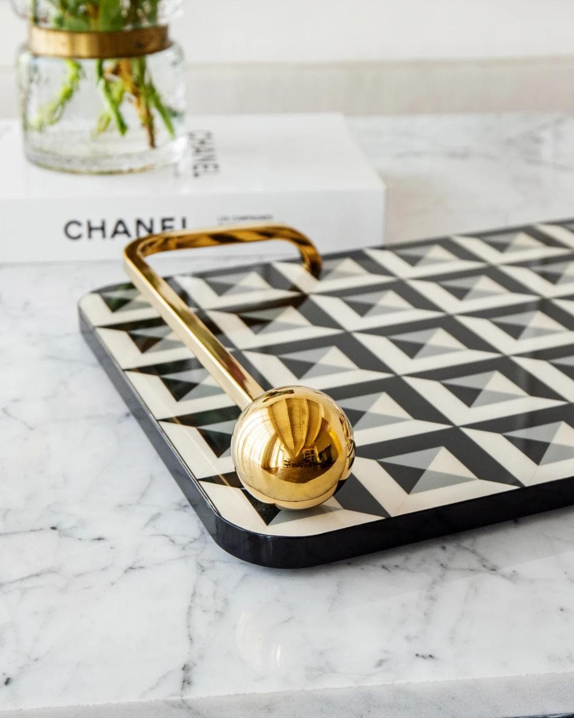 Stephen Bandiagara trays in black and gold, shown in a lifestyle close-up as image 4