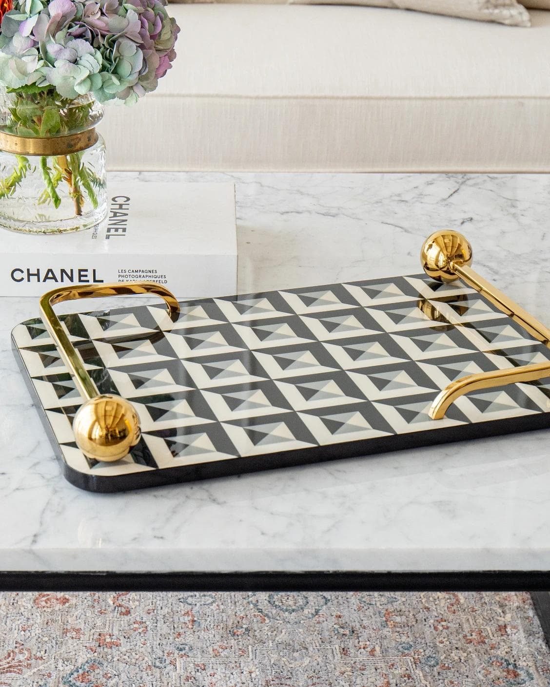 Stephen Bandiagara trays in black and gold, shown in a lifestyle front view as image 6