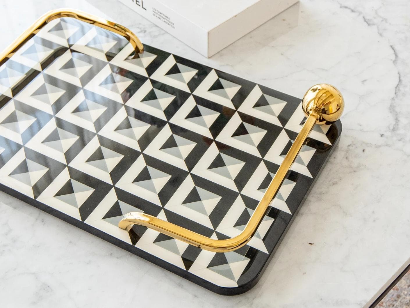 Stephen Bandiagara trays in black and gold, shown in a lifestyle top view as image 8