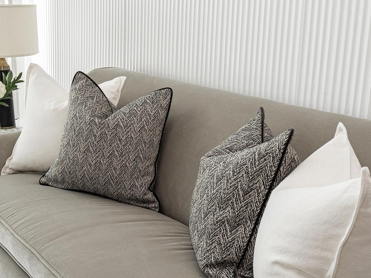 Rusman Bundle cushion in black and white, shown in a lifestyle right view as image 5