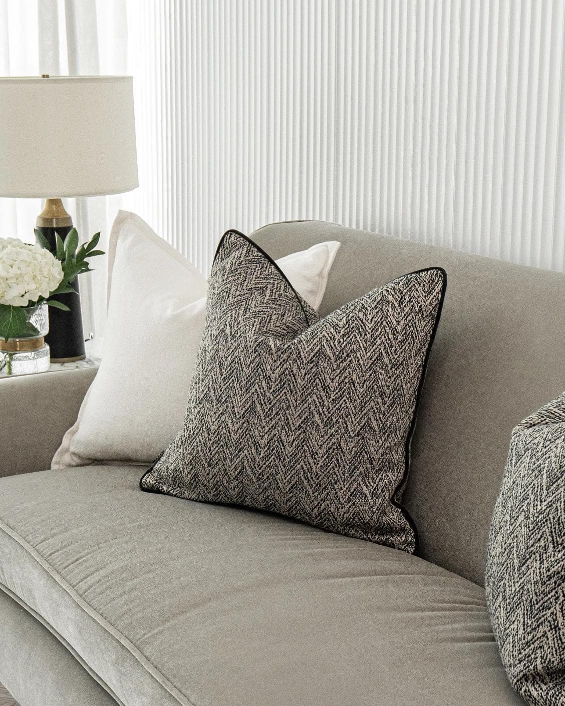 Rusman Bundle cushion in black and white, shown in a lifestyle right view as image 5
