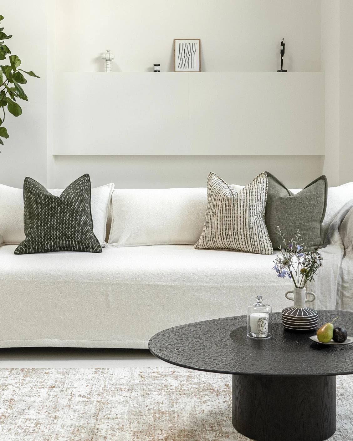 Suki Bundle cushion in green and beige, shown in a lifestyle front view as image 4