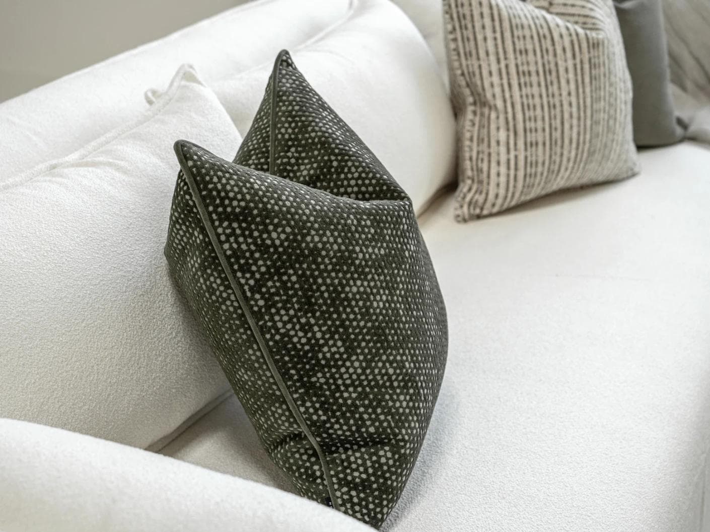 Suki Bundle cushion in green and beige, shown in a product left view as image 6