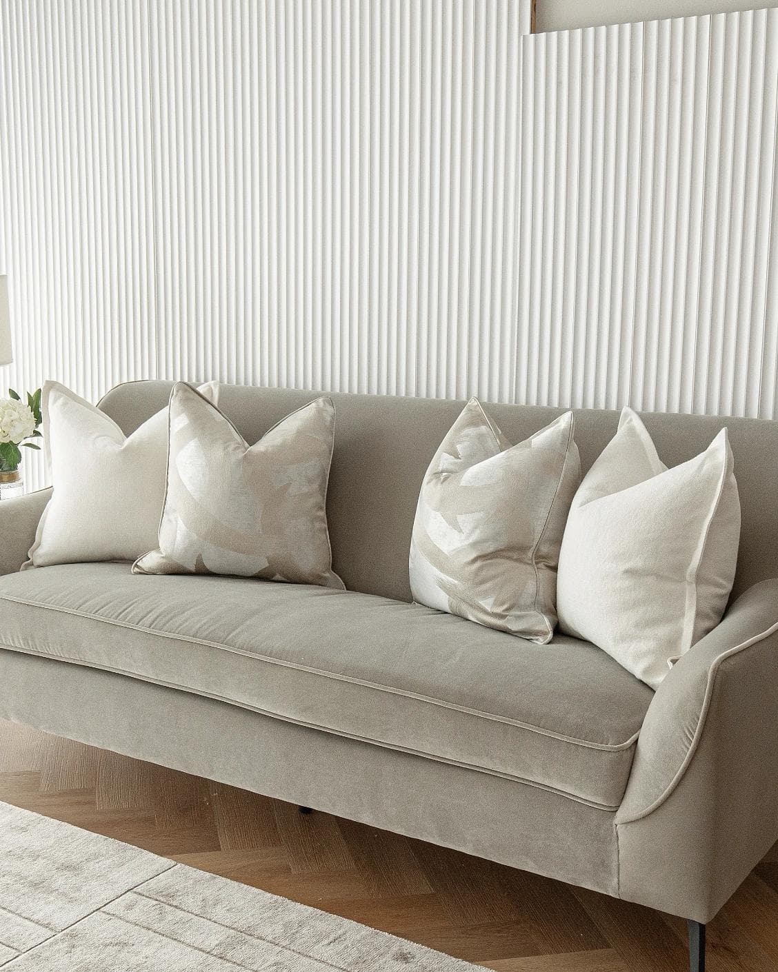 Landers Bundle cushion in white, silver and beige, shown in a lifestyle right view as image 4