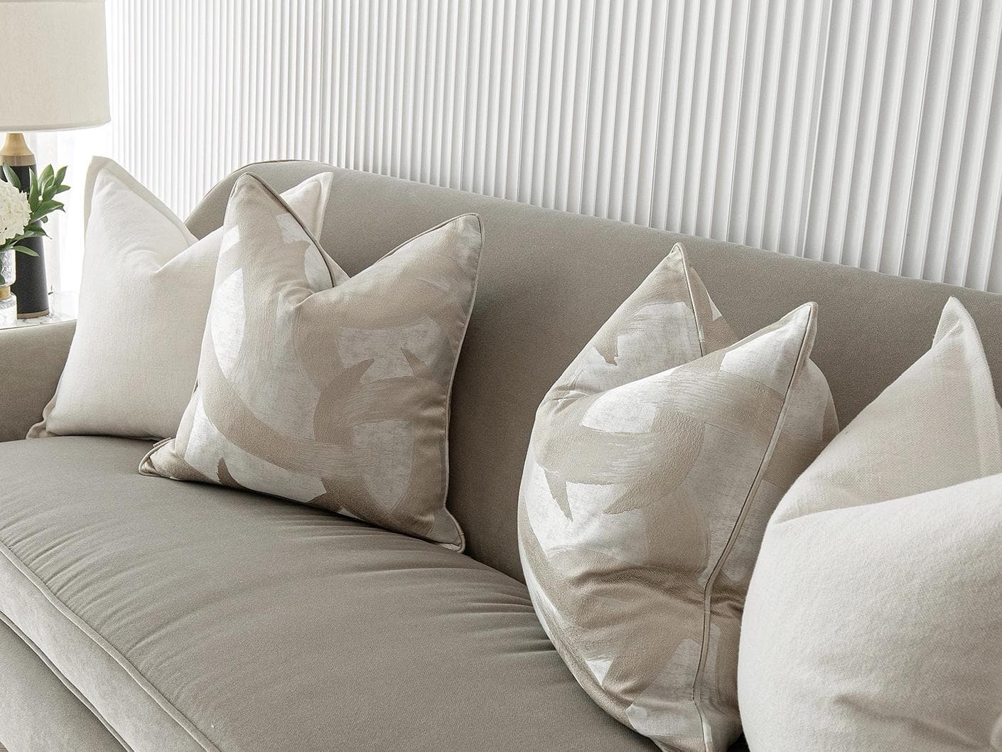 Landers Bundle cushion in white, silver and beige, shown in a lifestyle right view as image 5
