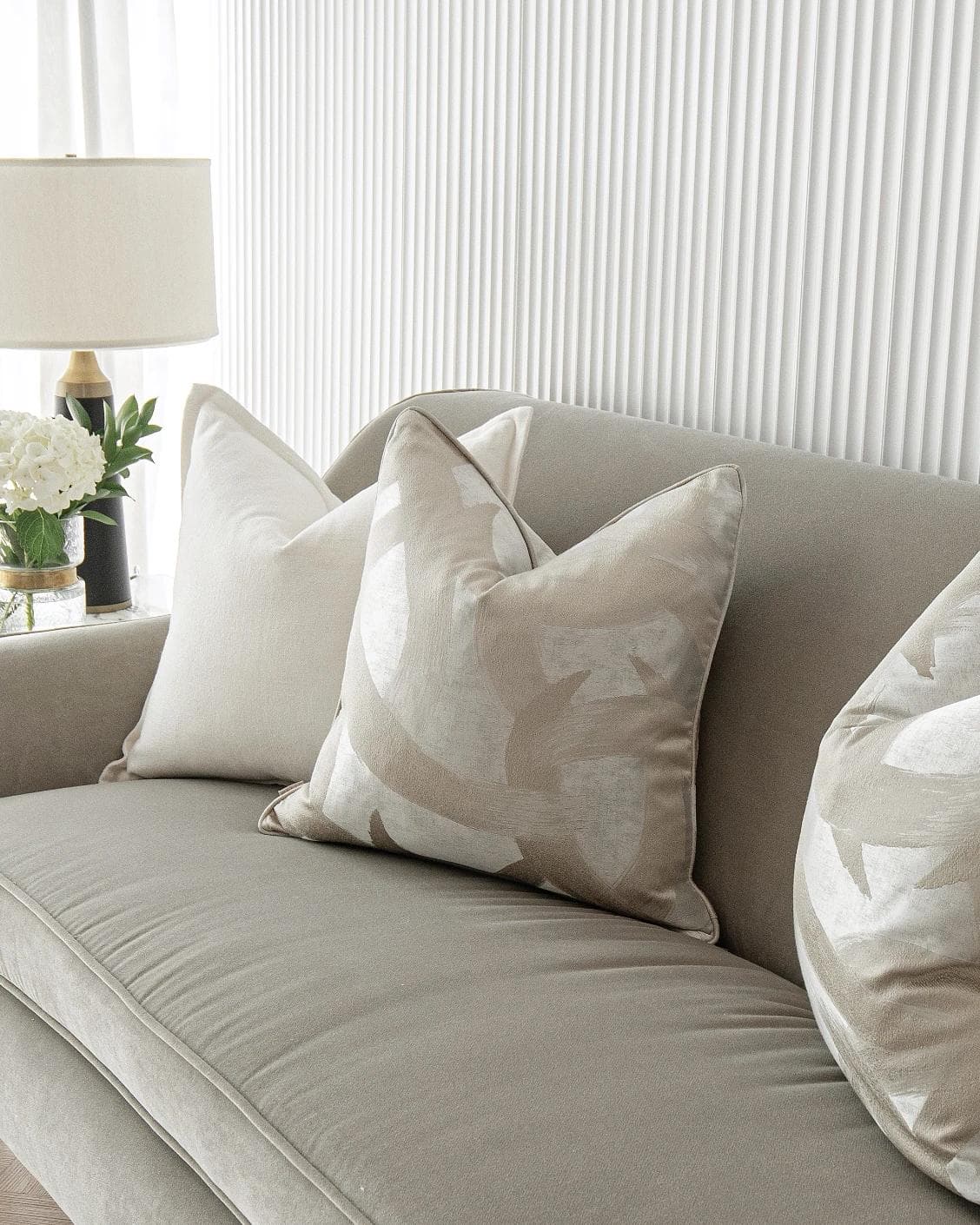 Landers Bundle cushion in white, silver and beige, shown in a lifestyle right view as image 5