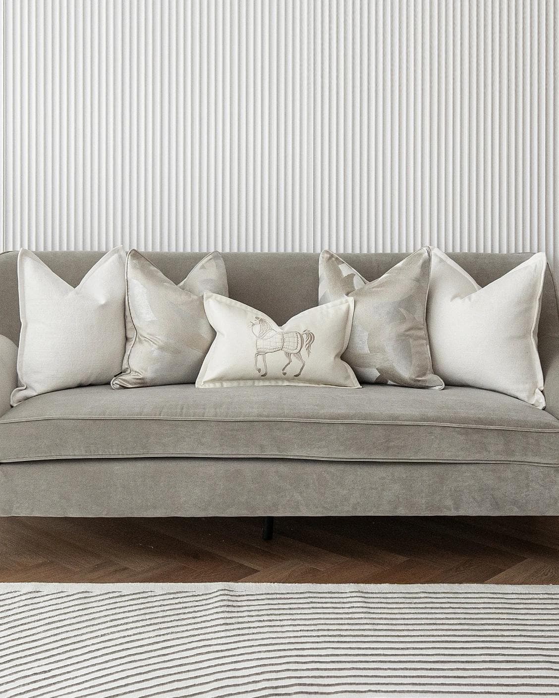 Honey Bundle cushion in white, shown in a lifestyle front view as image 2