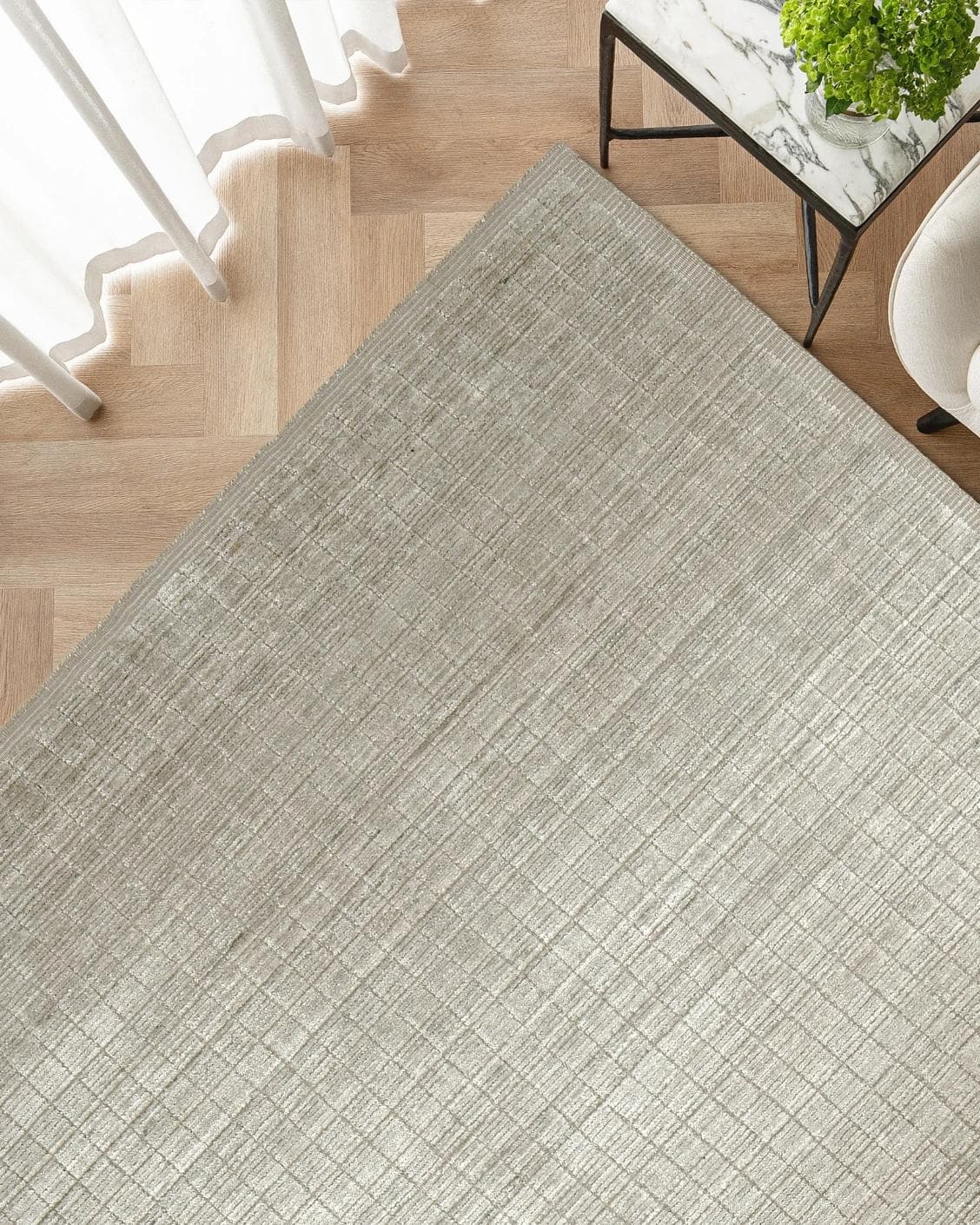 Taylor Sandy carpet in beige, shown in a lifestyle top view as image 2