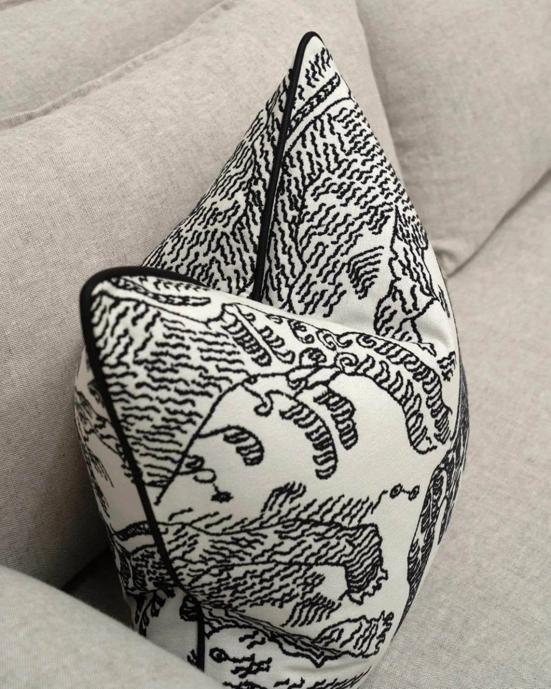 Tessa Steele cushion in ivory and charcoal, shown in a lifestyle top view as image 5
