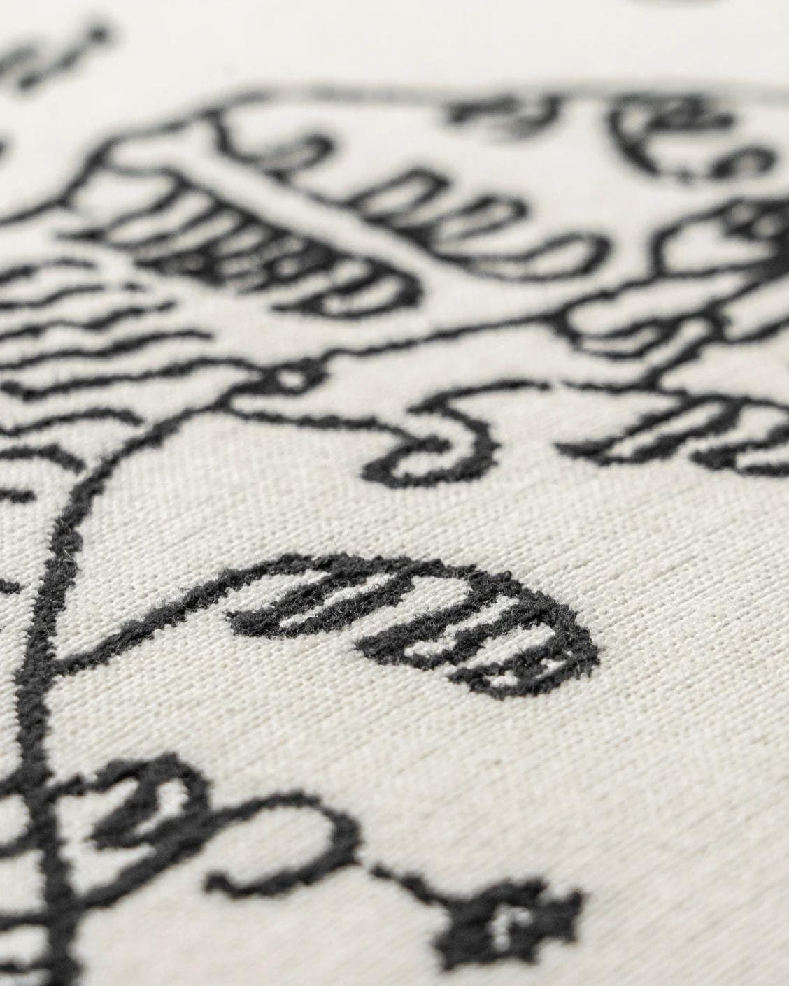 Tessa Steele cushion in ivory and charcoal, shown in a product close-up as image 7
