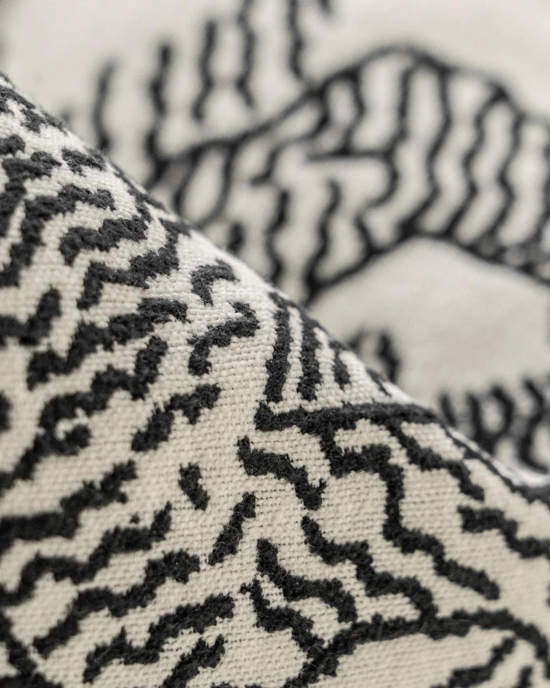 Tessa Steele cushion in ivory and charcoal, shown in a product close-up as image 8