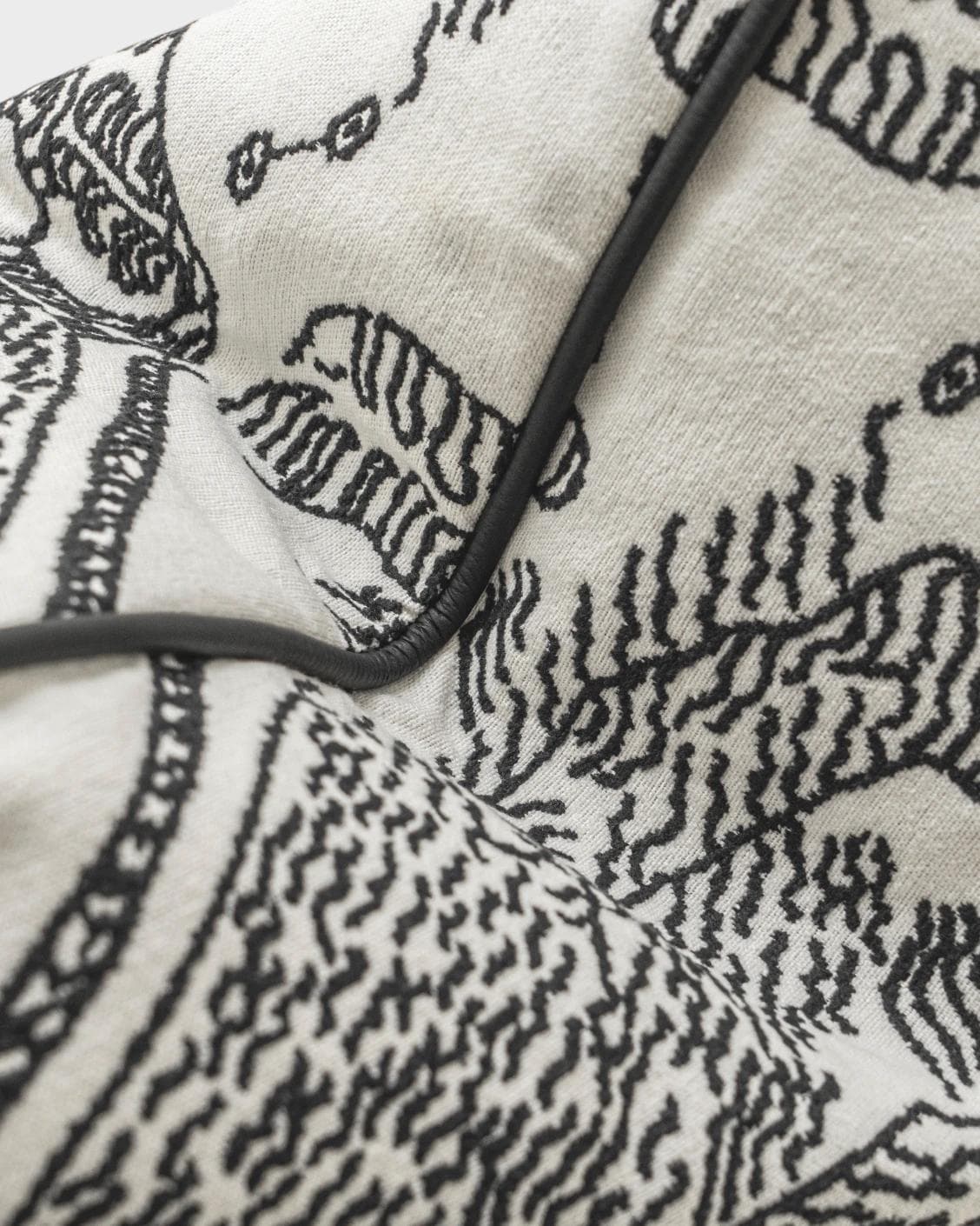 Tessa Steele cushion in ivory and charcoal, shown in a product top view as image 12