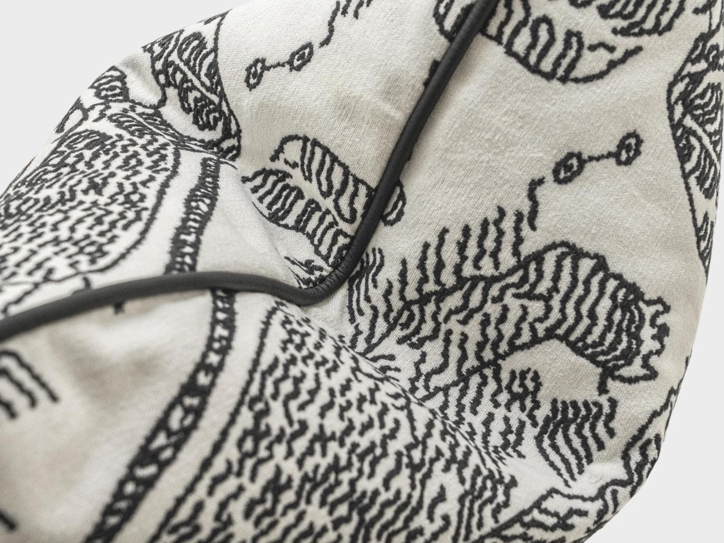 Tessa Steele cushion in ivory and charcoal, shown in a product top view as image 12