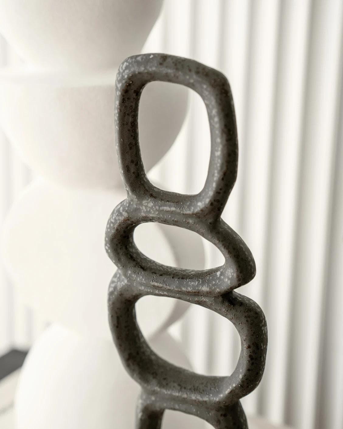 Tetra Laurian Bundle statues and sculptures in white and black, shown in a lifestyle close-up as image 4