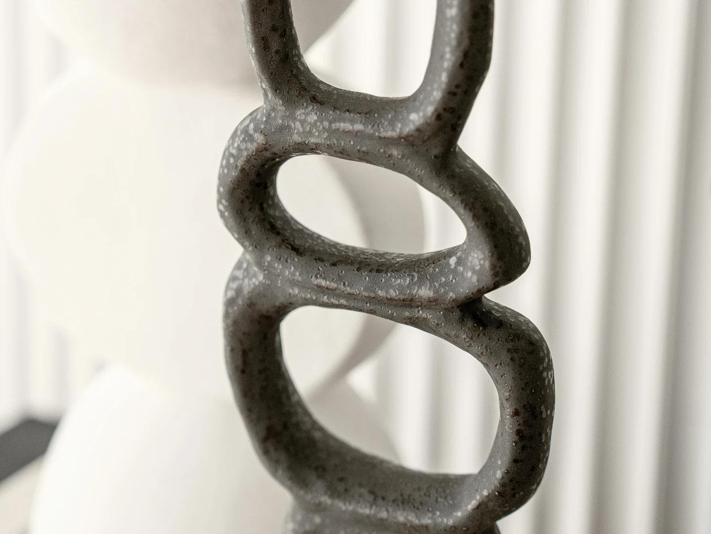 Tetra Laurian Bundle statues and sculptures in white and black, shown in a lifestyle close-up as image 4
