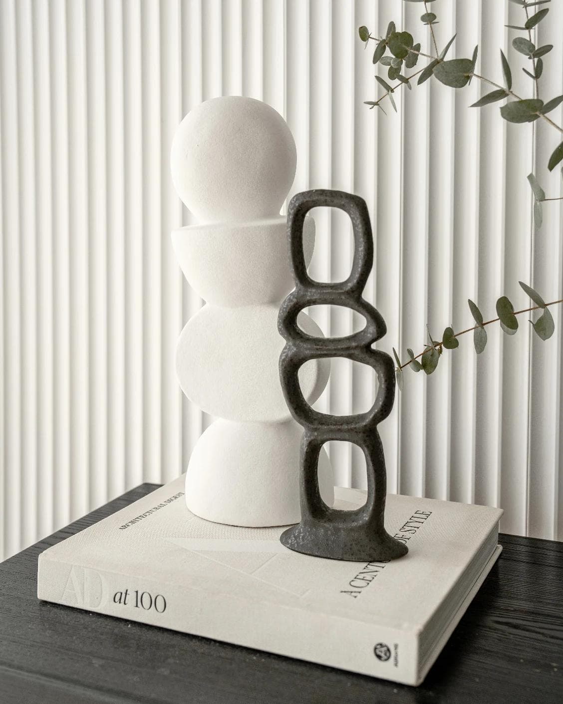 Tetra Laurian Bundle statues and sculptures in white and black, shown in a lifestyle right view as image 6