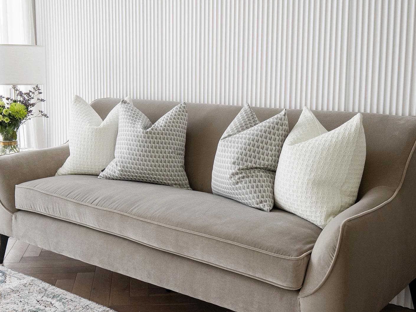 Therese Bundle cushion in white and silver, shown in a lifestyle right view as image 2