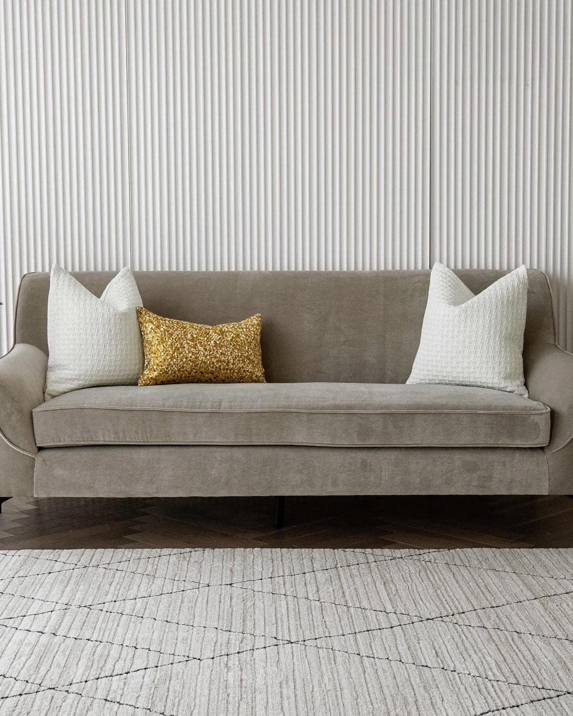 Maica Bundle cushion in white, gold and yellow, shown in a lifestyle front view as image 4