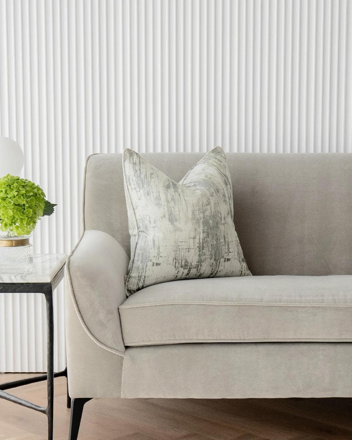 Theo Laurent cushion in grey and white, shown in a lifestyle front view as image 4