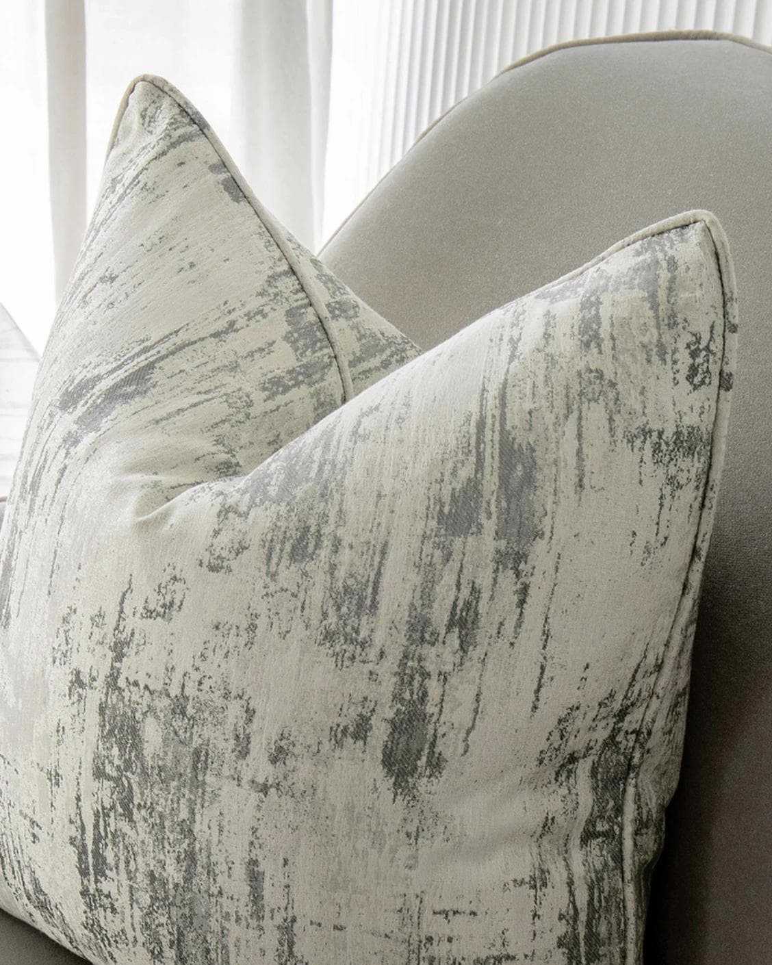 Theo Laurent cushion in grey and white, shown in a lifestyle right view as image 6
