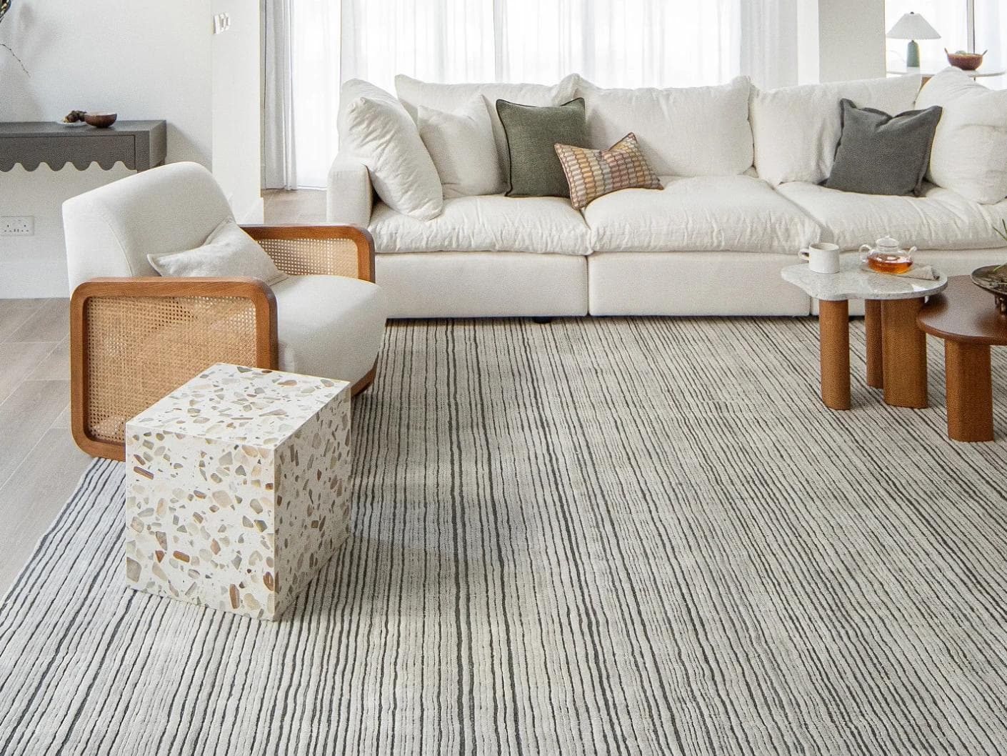 Theodore Ashton carpets in grey and ivory, shown in a lifestyle front view as image 3