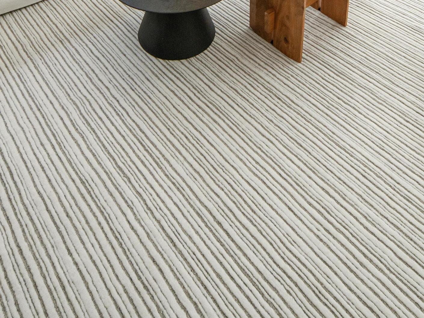 Theodore Dune carpets in grey and white, shown in a lifestyle close-up as image 1