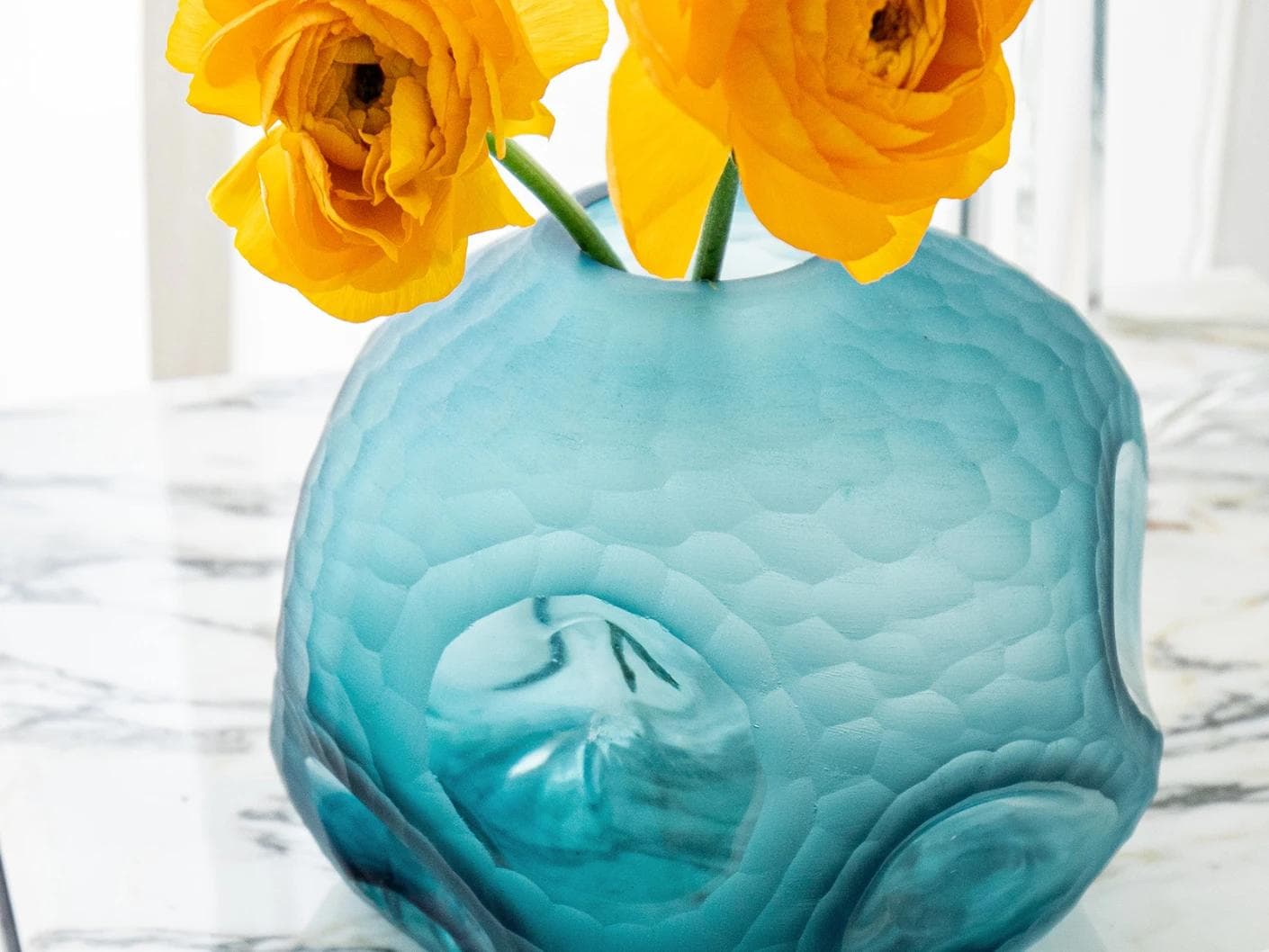 Tiffany Storms II vases in turquoise, shown in a lifestyle front view as image 2