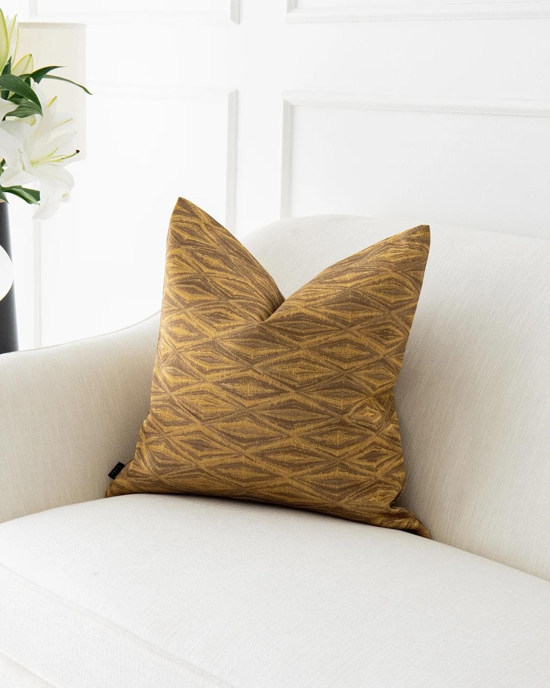 Titus Hodler cushion in yellow, shown in a lifestyle front view as image 2
