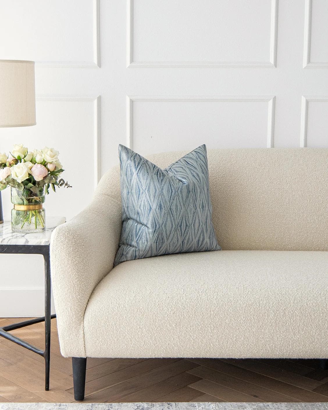 Titus Matisse cushion in silver and blue, shown in a lifestyle front view as image 4