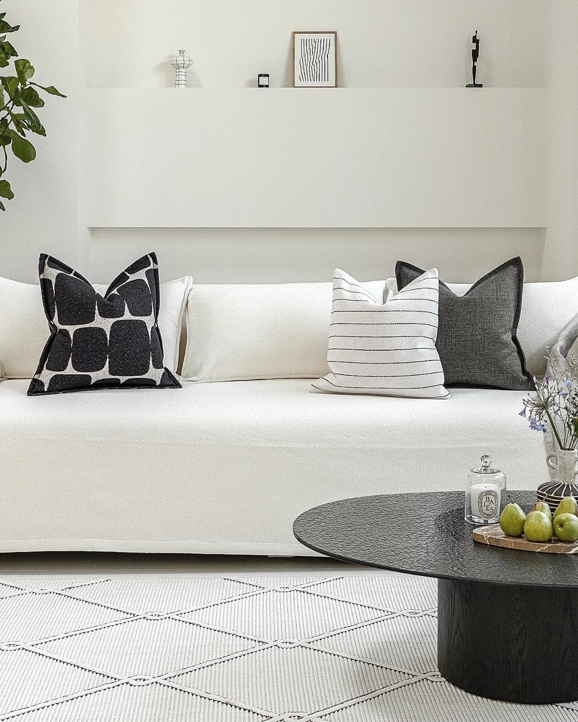 Tova Bundle cushion in black and white, shown in a lifestyle front view as image 4