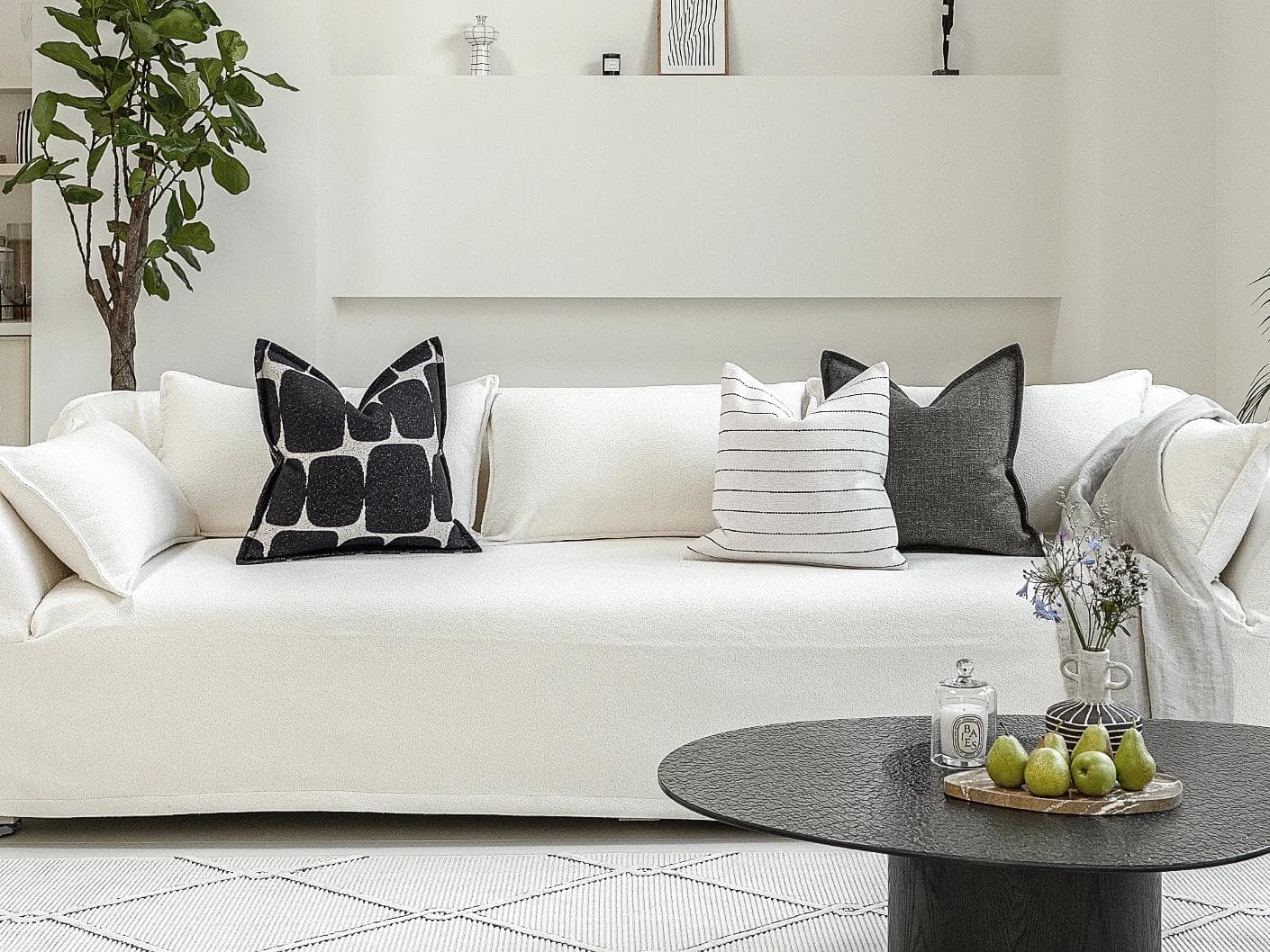 Tova Bundle cushion in black and white, shown in a lifestyle front view as image 4