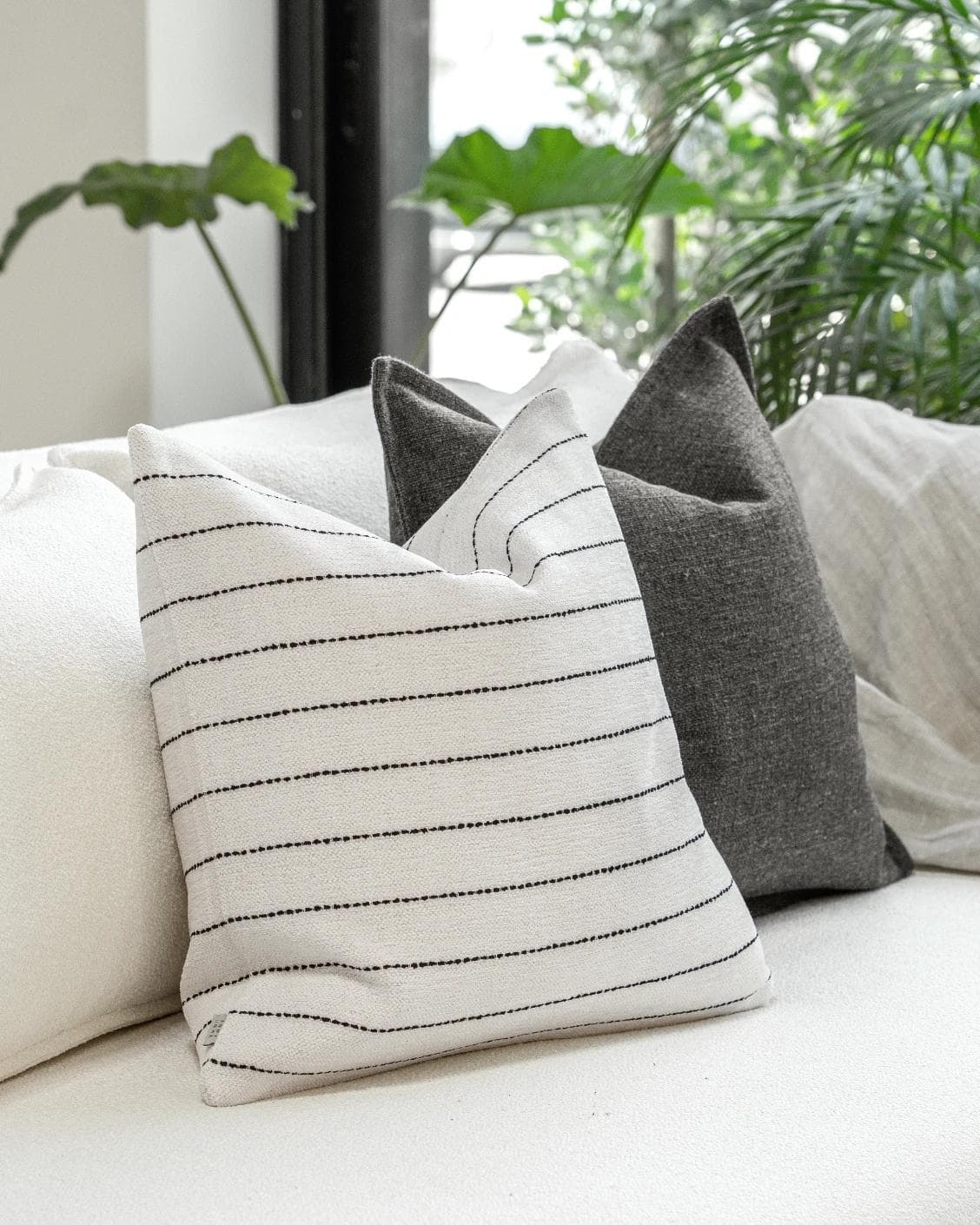 Tova Bundle cushion in black and white, shown in a product left view as image 5