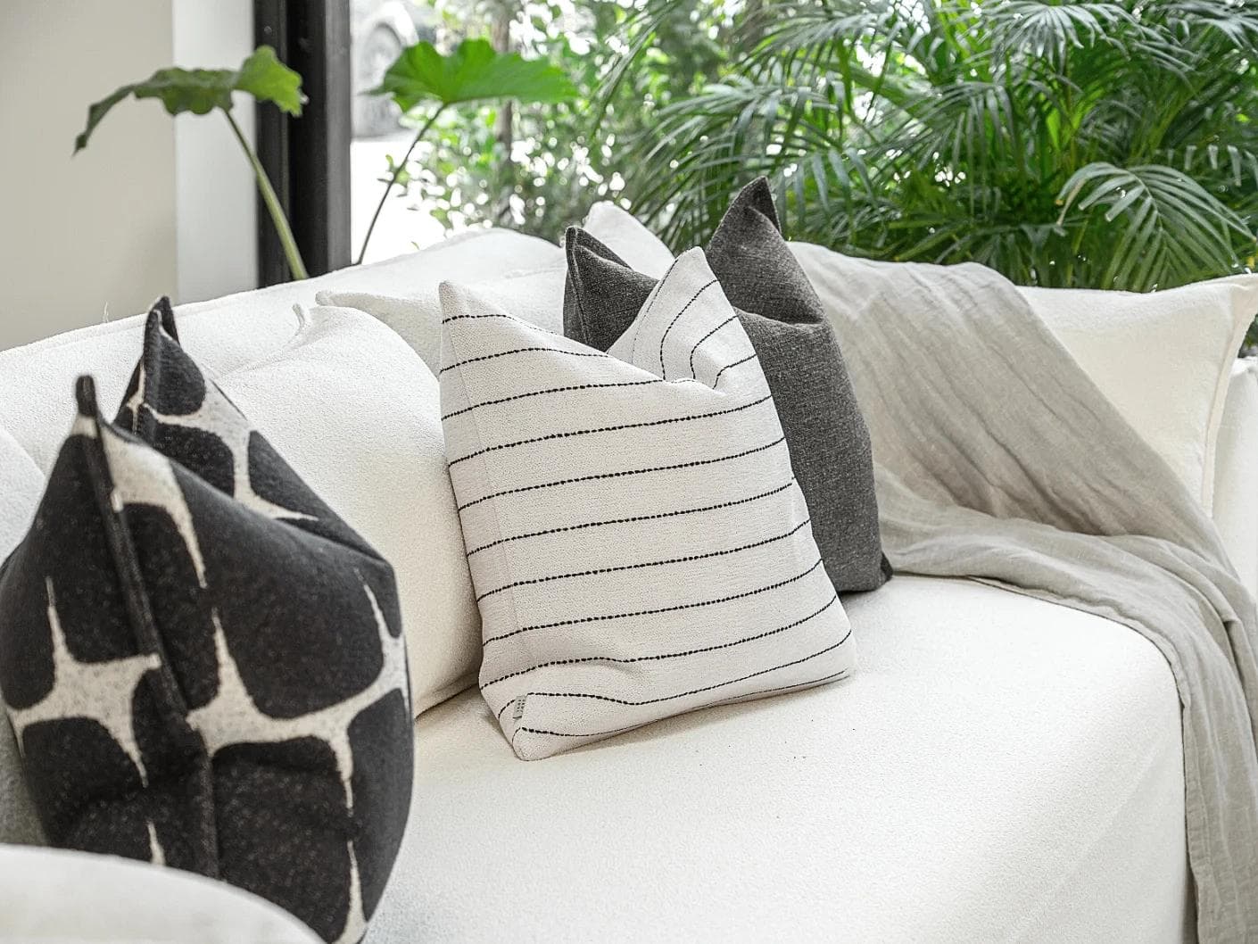 Tova Bundle cushion in black and white, shown in a product left view as image 6