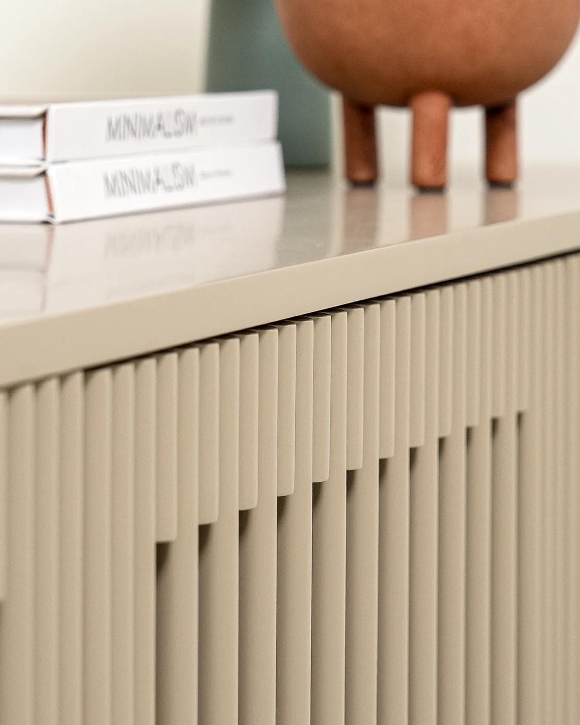 Treviso TV unit in warm clay and taupe, shown in a lifestyle close-up as image 4