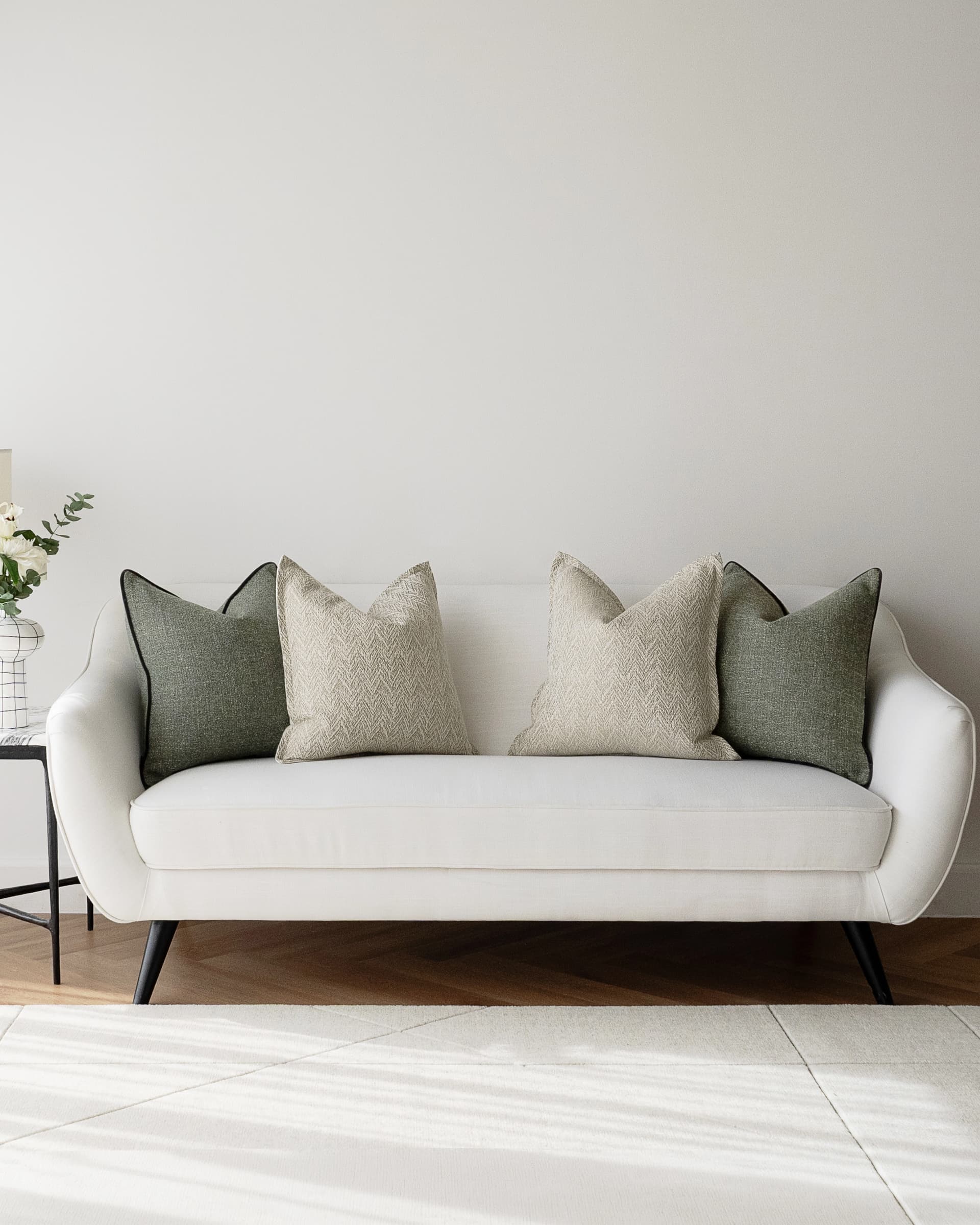 Trish Bundle cushion in beige and green, shown in a lifestyle front view as image 4