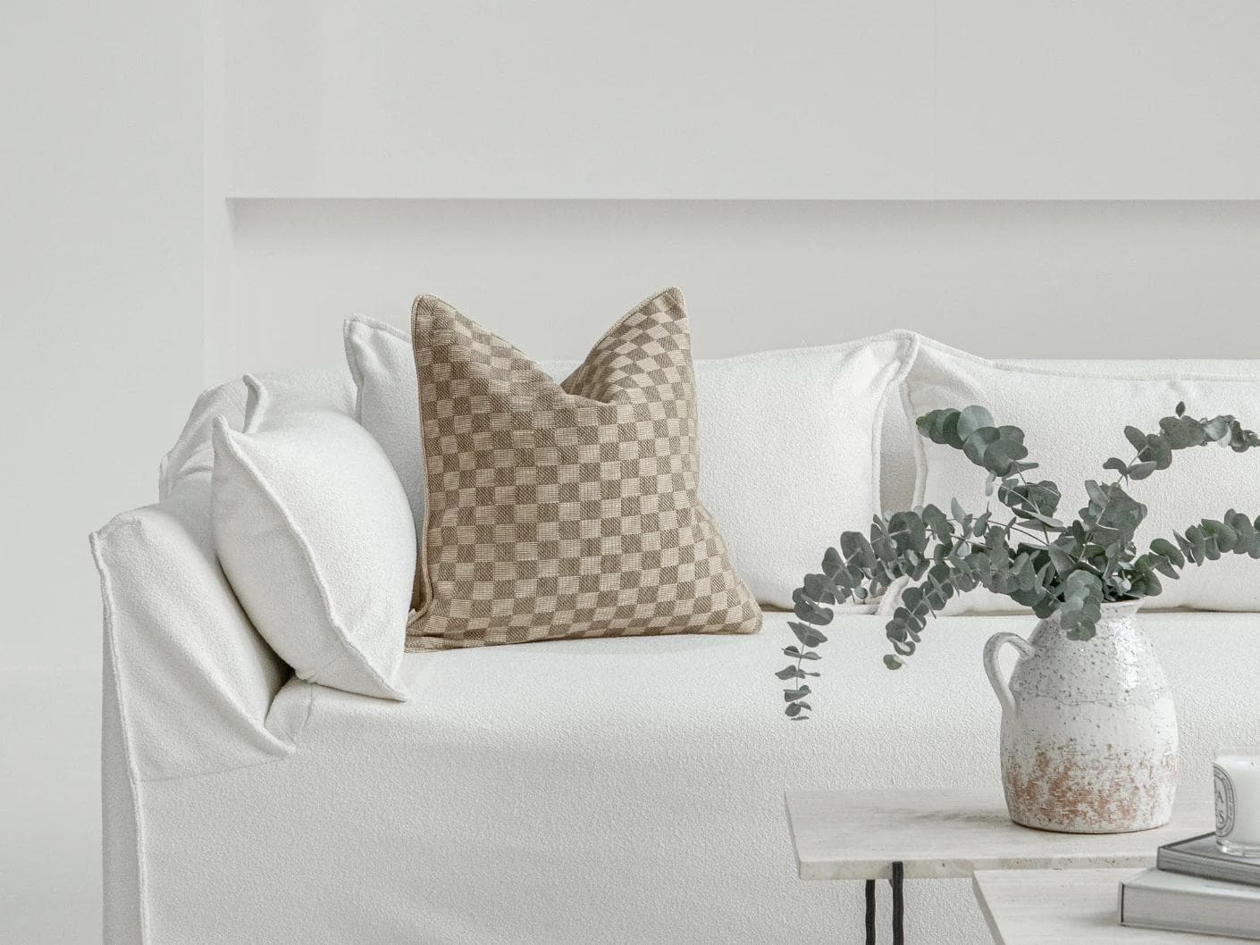 Troi Klimt cushion in taupe and beige, shown in a lifestyle front view as image 4