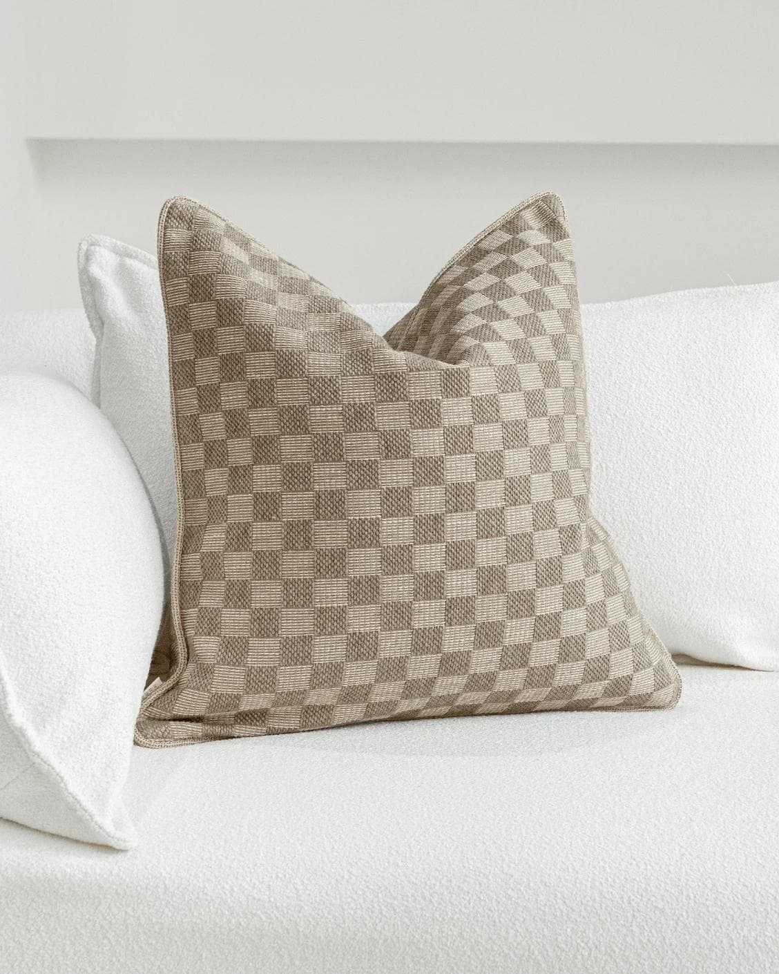 Troi Klimt cushion in taupe and beige, shown in a lifestyle front view as image 2