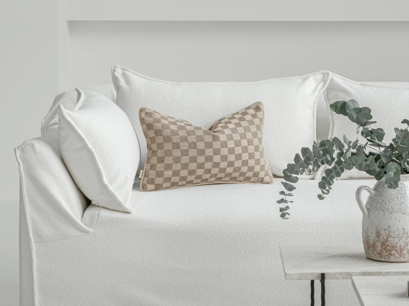 Troi Klimt II cushion in taupe and beige, shown in a lifestyle front view as image 4