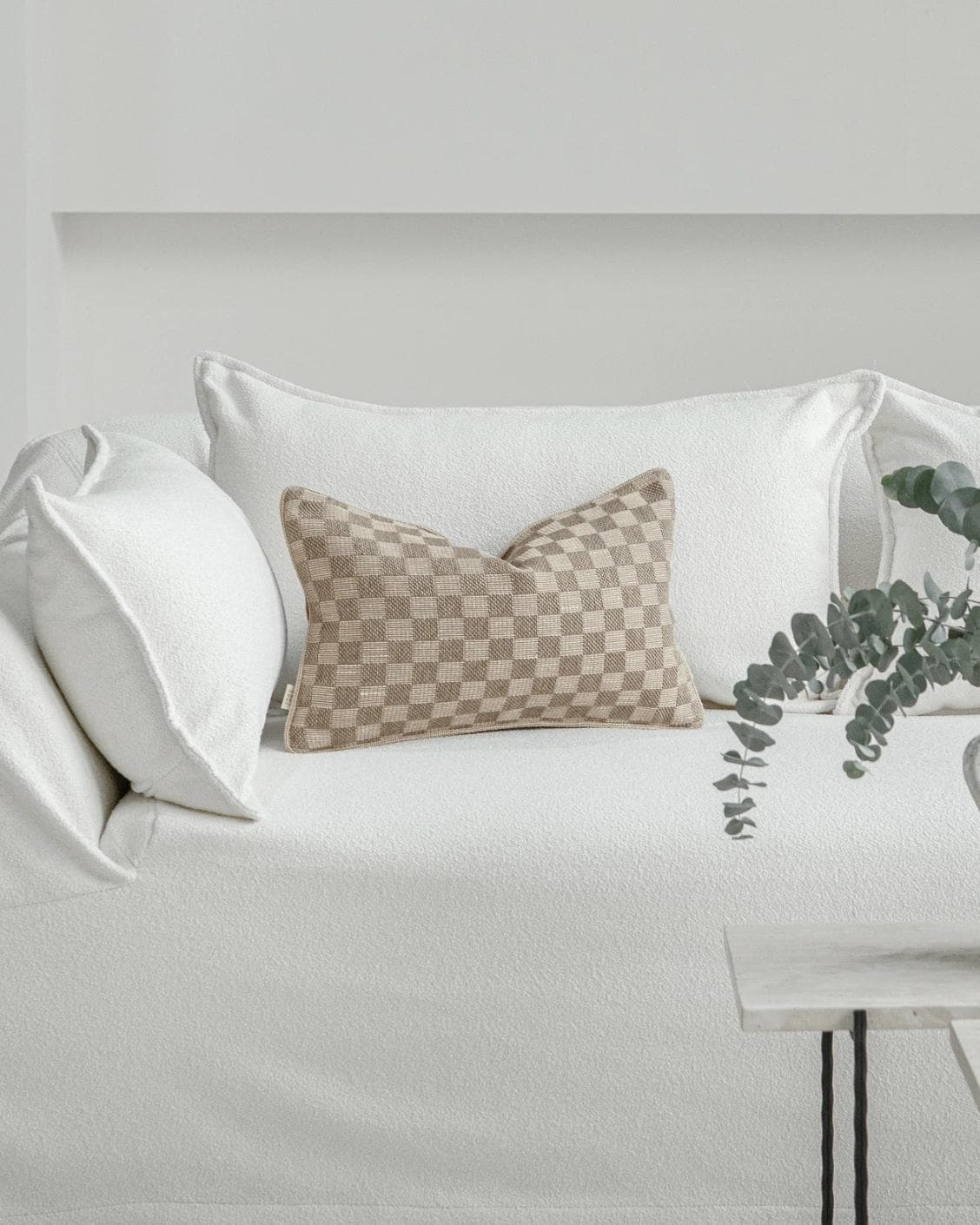 Troi Klimt II cushion in taupe and beige, shown in a lifestyle front view as image 4