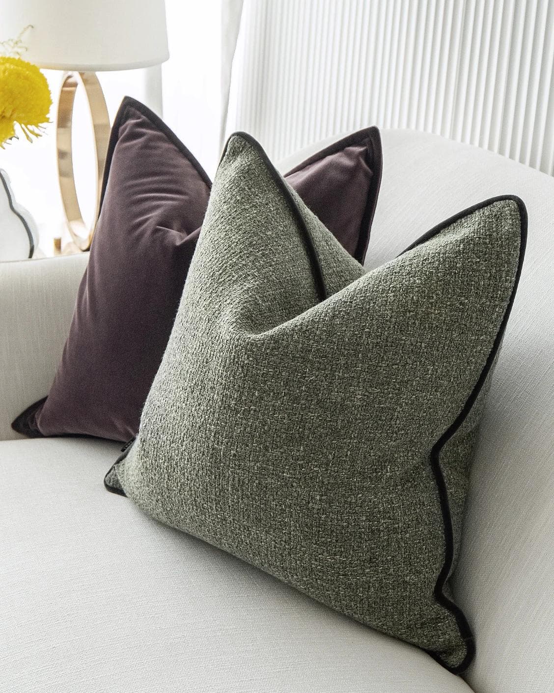 Kamelia Bundle cushion in purple and green, shown in a lifestyle right view as image 6